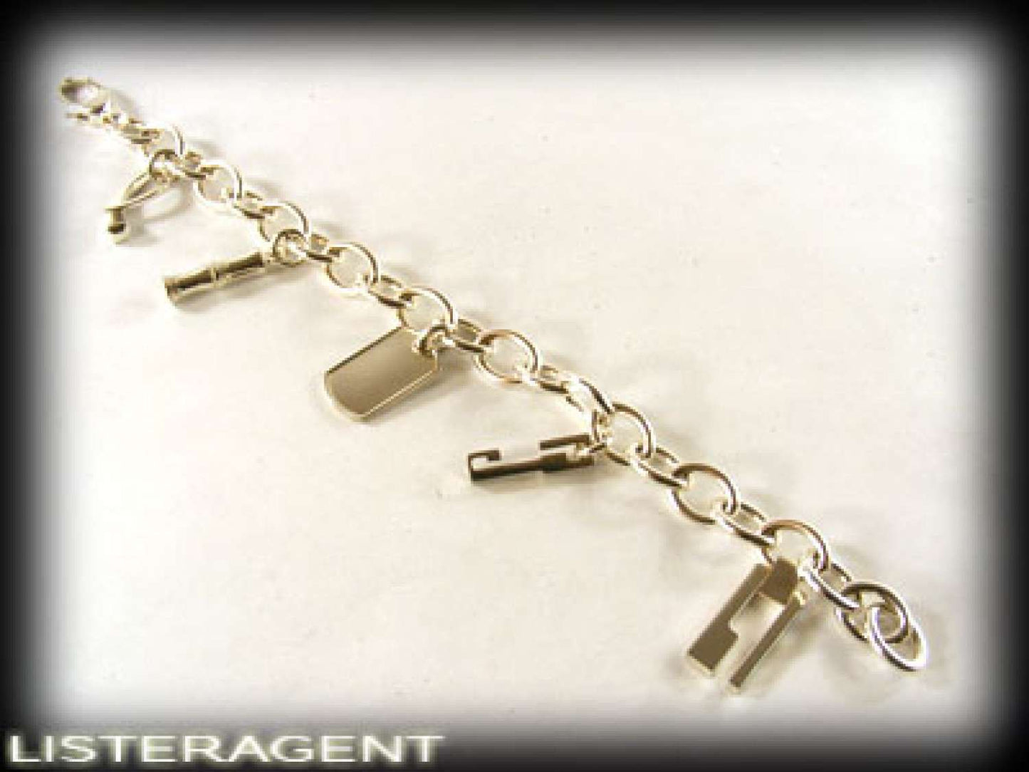 GUCCI BRACELET WITH PENDANTS IN 925 SILVER