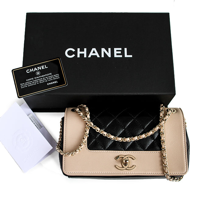 Mademoiselle Vintage Flap Bag in black and beige shiny sheepskin leather