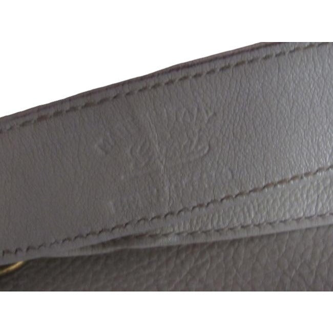 Vintage 1970s Gucci white textured leather Blondie style saddle bag with XL gold GG logo cutout in mint condition