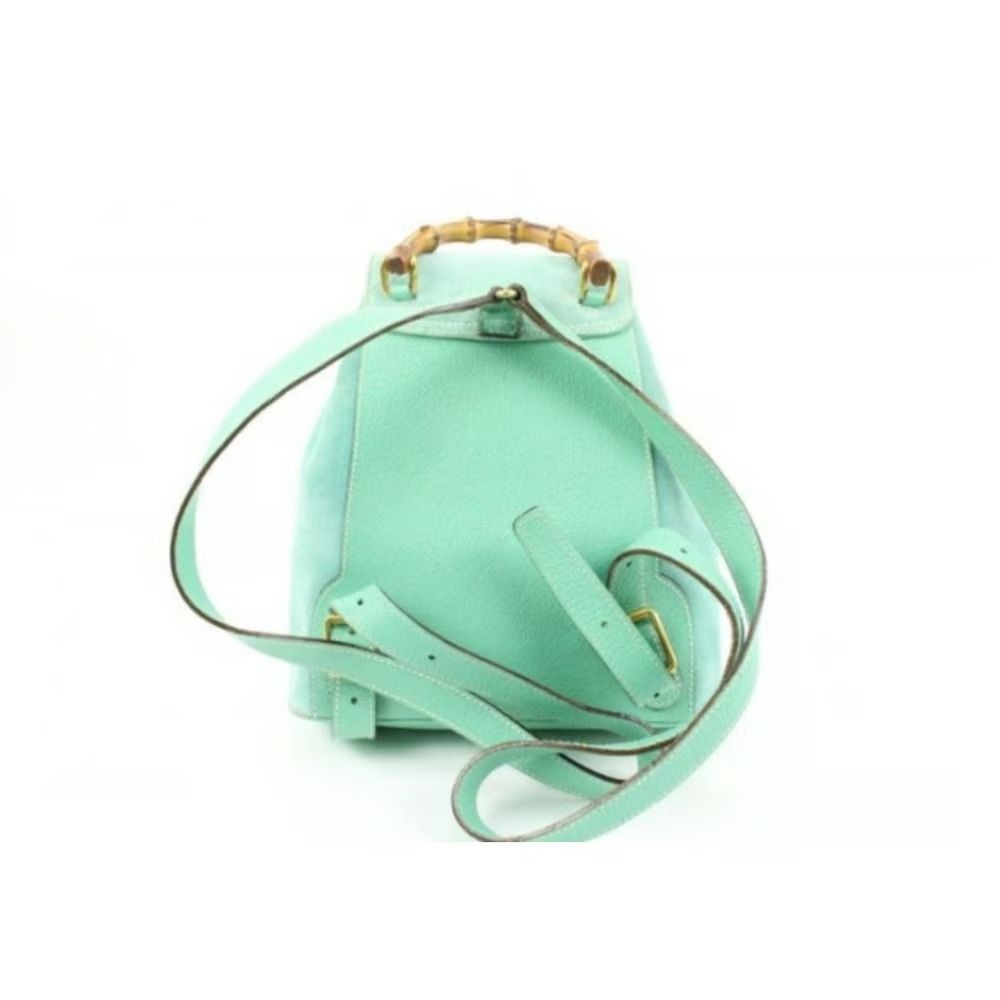 Tom Ford era, Gucci, aqua color, suede and leather, messenger bag/backpack with an exterior pocket, drawstring top closure