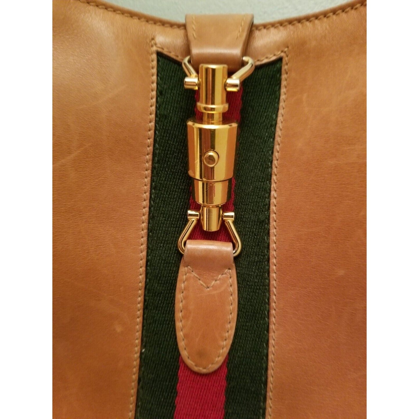 Rare, vintage, Gucci, camel leather 1961 Jackie hobo shoulder bag with a red & green center stripe, gold piston closure, & extender strap