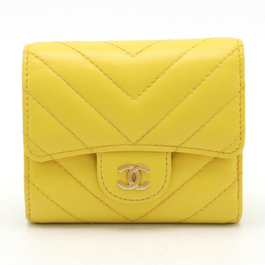 CHANEL Chevron V-stitch Coco Mark Tri-fold Wallet Leather Yellow A81900