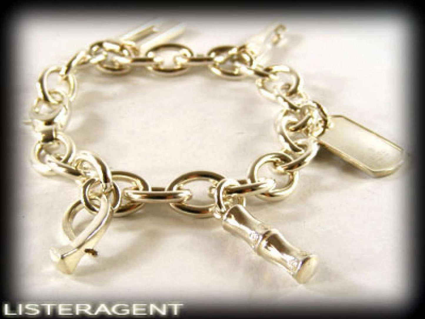 GUCCI BRACELET WITH PENDANTS IN 925 SILVER