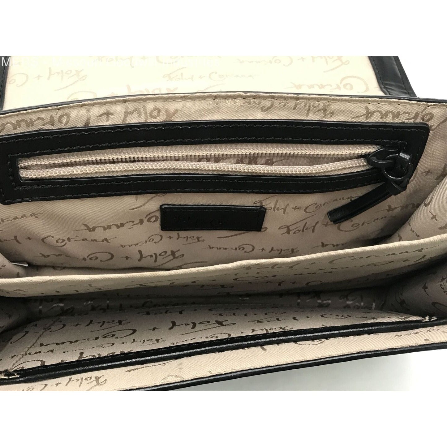 Foley & Corina, black leather, crossbody purse with an envelope top, a back zip pocket and lots of interior pockets.