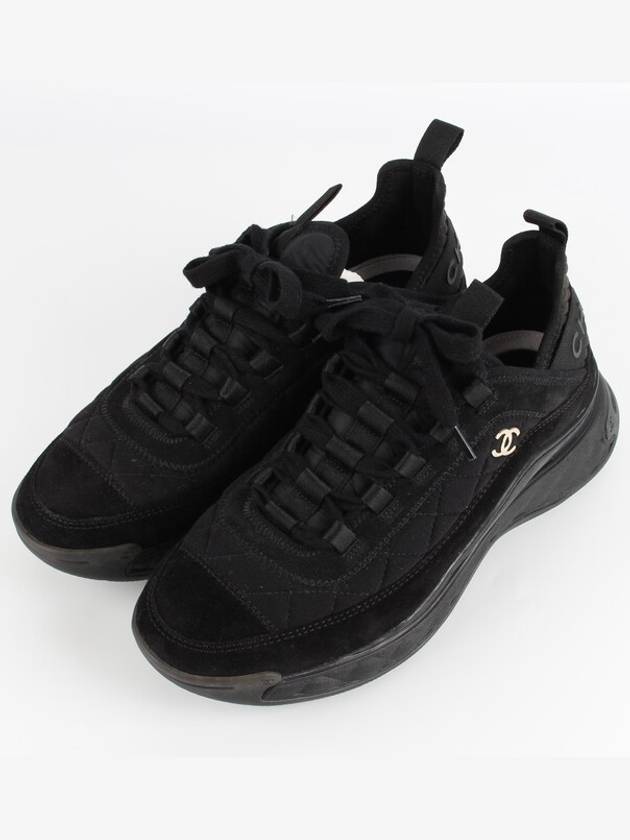 Mixed fiber black quilted gold sneakers 39 260 Chanel
