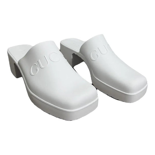 Leather mules & clogs Gucci White