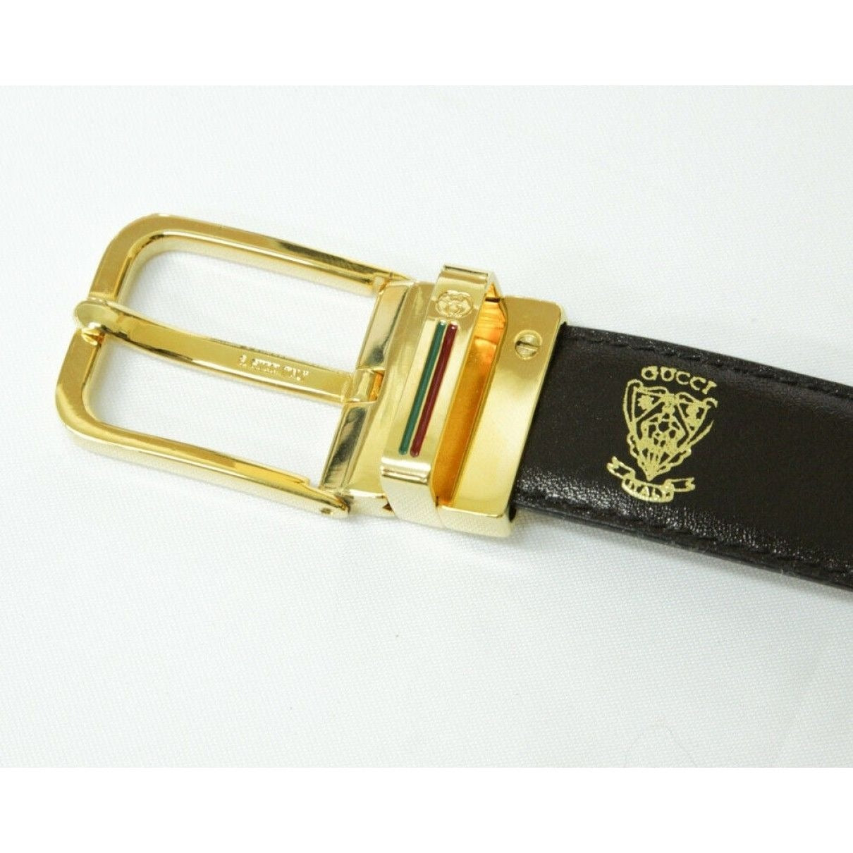 Vintage, NOS, Gucci, brown or black leather, 38" - 42", reversible belt with a removable,  rectangular, gold tone buckle with red and green