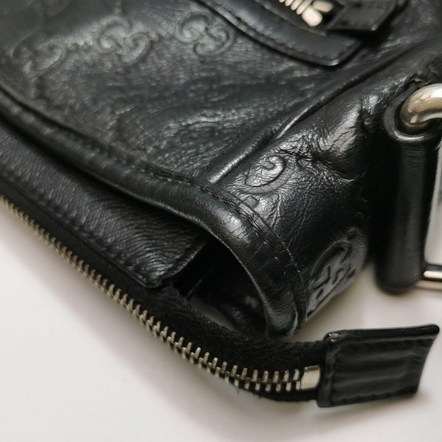 Gucci GG Embossed Leather Crossbody Bag