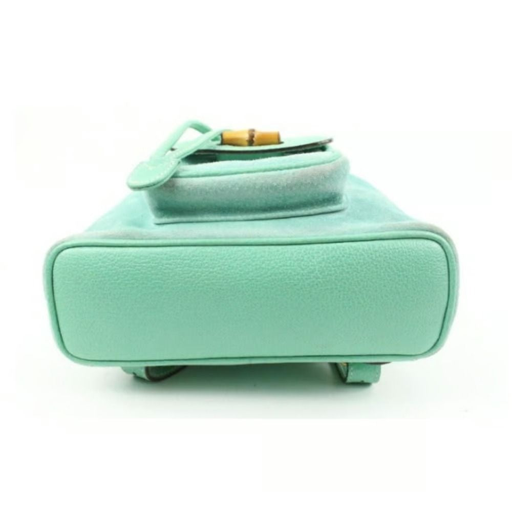 Tom Ford era, Gucci, aqua color, suede and leather, messenger bag/backpack with an exterior pocket, drawstring top closure