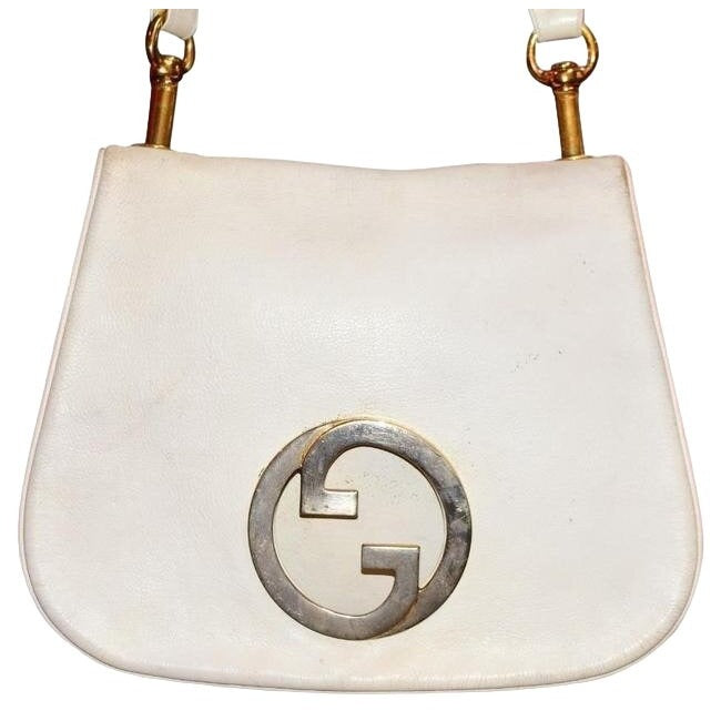 Vintage 1970s Gucci white textured leather Blondie style saddle bag with XL gold GG logo cutout in mint condition
