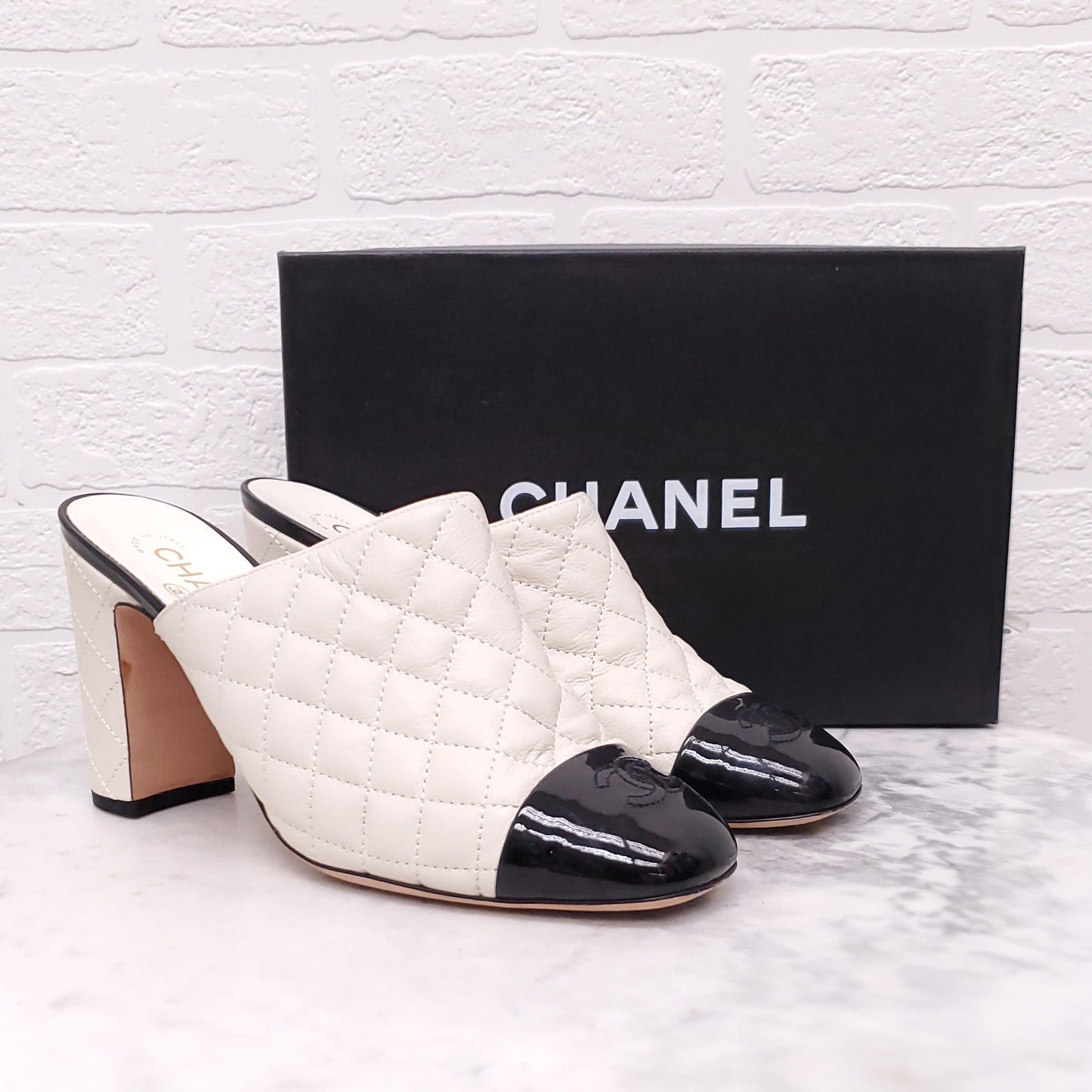 CHANEL CREAM AND BLACK TOE CAP QUILTED HEELED MULES - SIZE 41.5