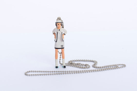 Chanel Coco Doll Pendant Necklace with Comic Book, Dust Cover & Box
