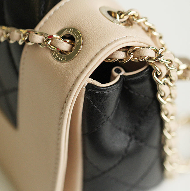 Mademoiselle Vintage Flap Bag in black and beige shiny sheepskin leather