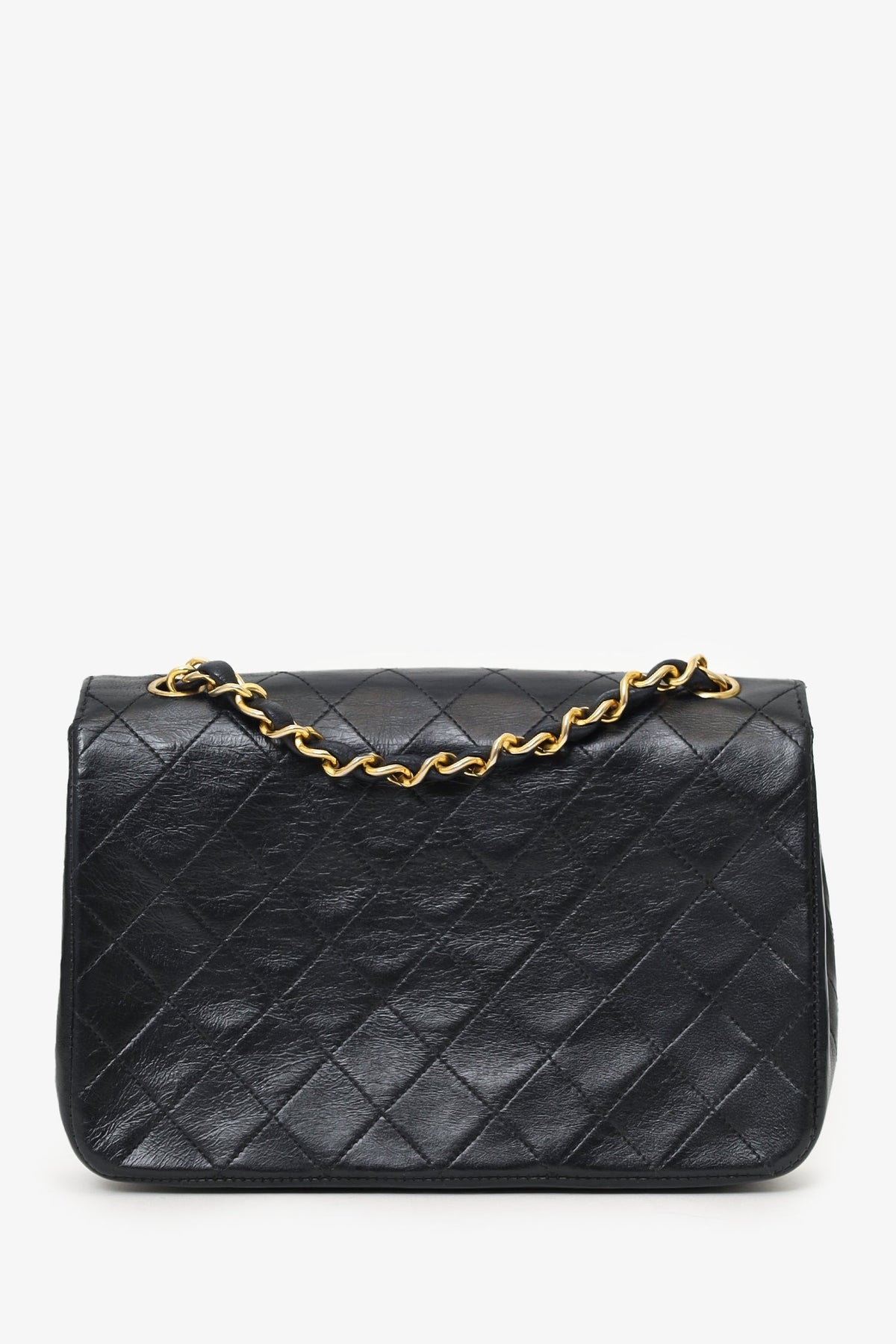 Chanel™ 1986-88 Black Quilted Lambskin Circle CC Mini Flap Bag