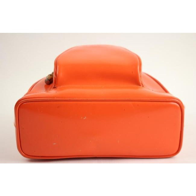 Tom Ford era, Gucci, petite, bright orange patent leather and smooth leather, triangular, messenger bag or backpack with a dual zip closure