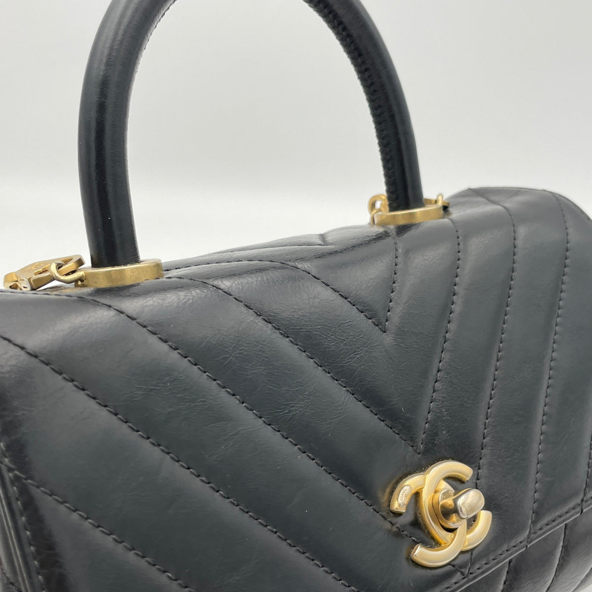 Coco Flap Black Top Handle Bag in Calfskin, Gold hardware