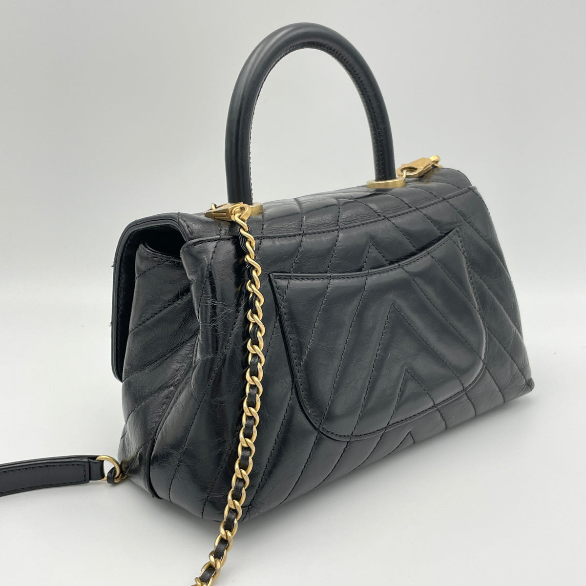 Coco Flap Black Top Handle Bag in Calfskin, Gold hardware