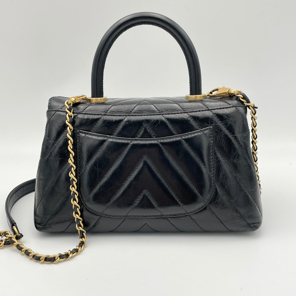 Coco Flap Black Top Handle Bag in Calfskin, Gold hardware