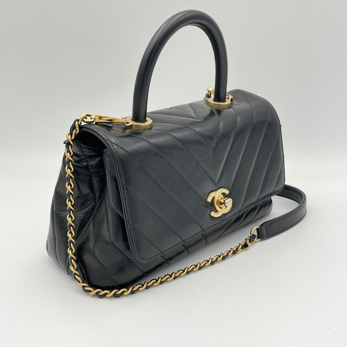 Coco Flap Black Top Handle Bag in Calfskin, Gold hardware