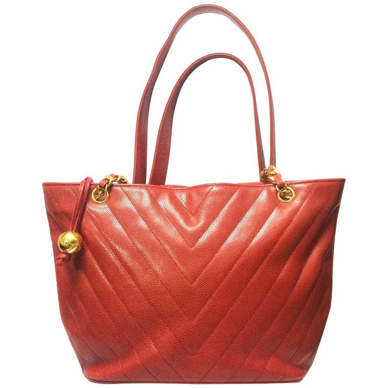 Chanel Vintage red caviarskin v stitch, chevron style chain shoulder Tote Bag with golden CC ball charm