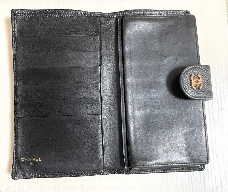 Chanel Vintage black caviar leather wallet with stitches and gold tone CC motif