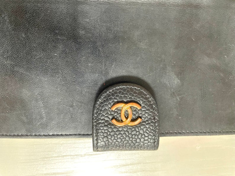 Chanel Vintage black caviar leather wallet with stitches and gold tone CC motif