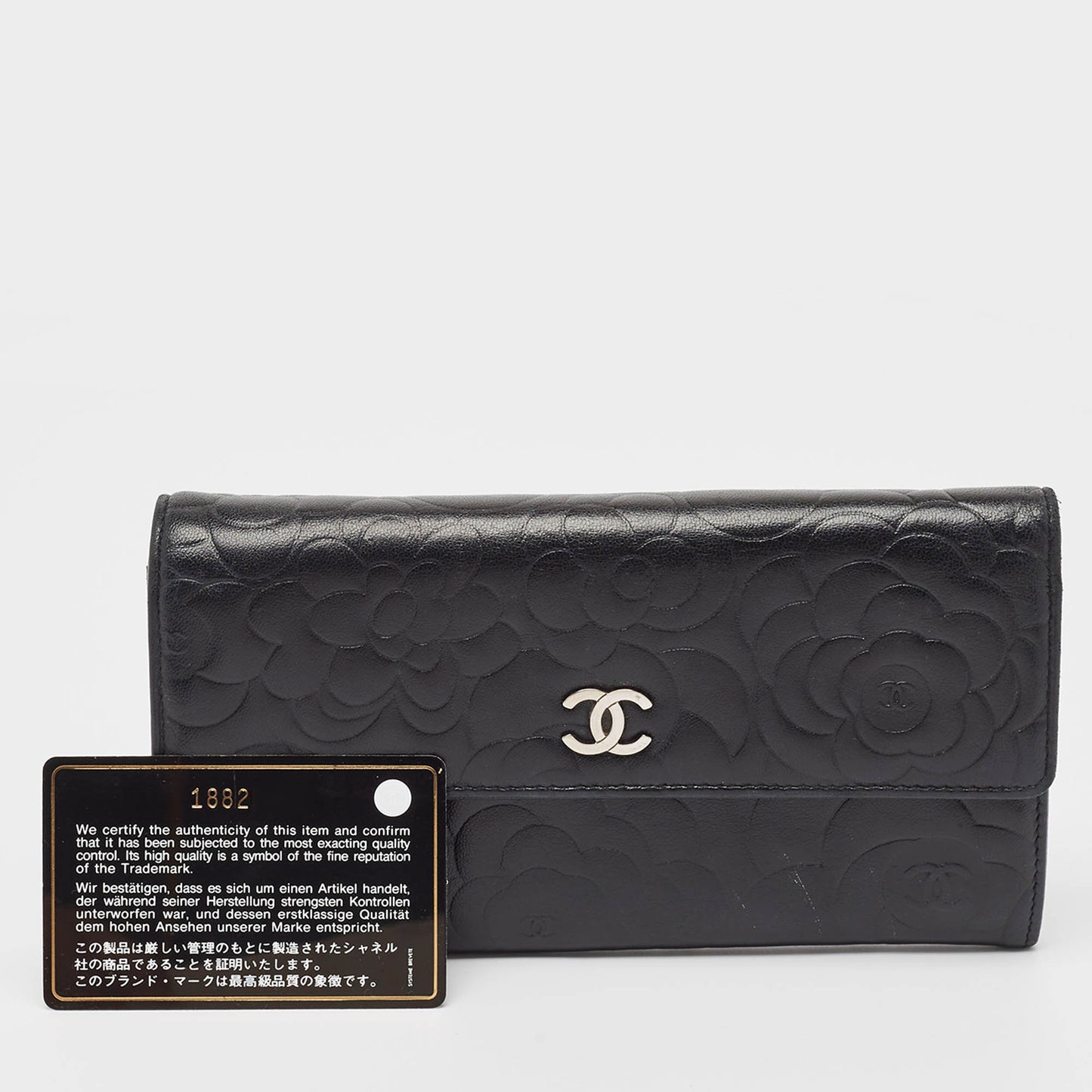 CHANEL Black Camellia Embossed Leather Large Flap Wallet